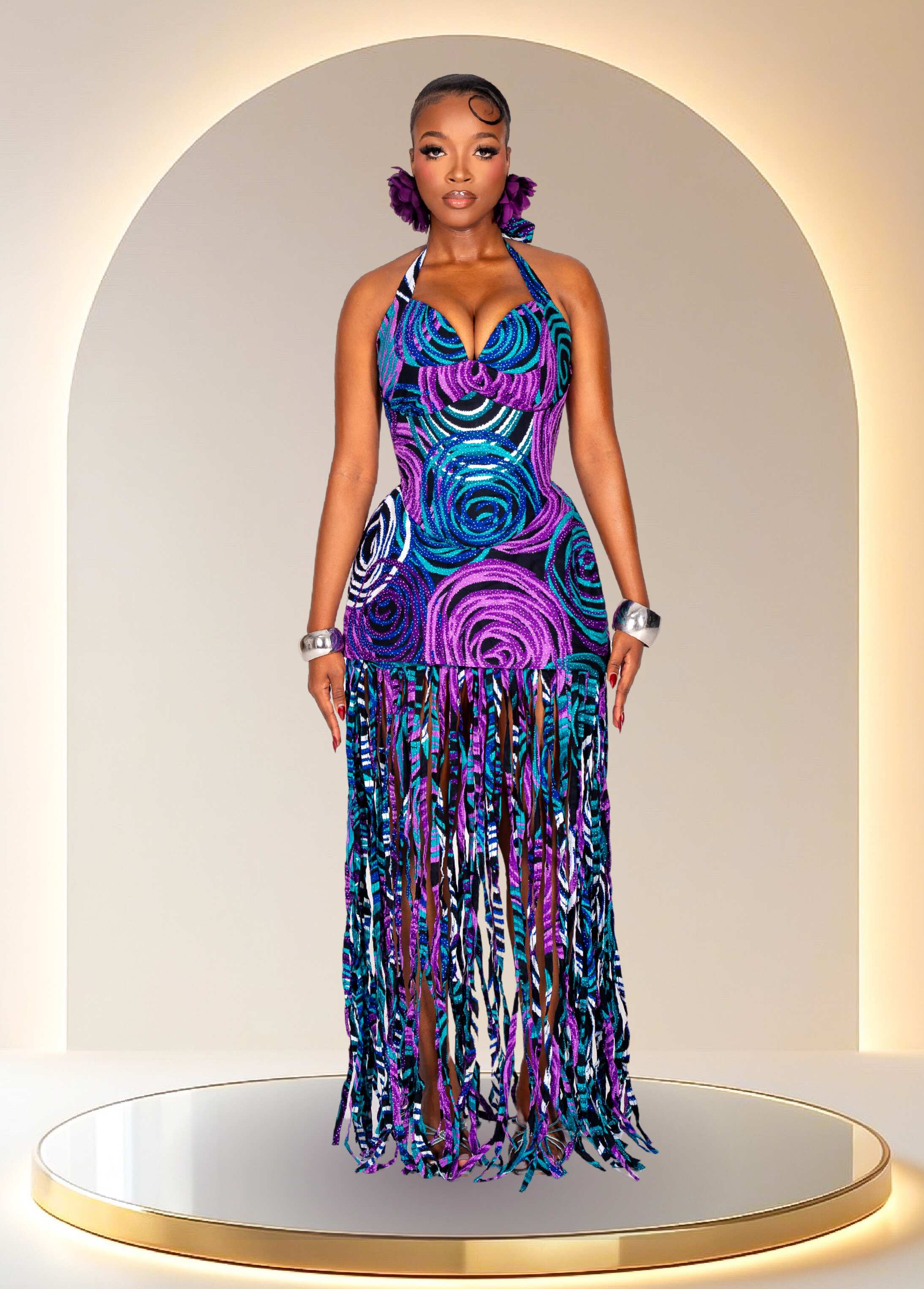 Woman wearing a PINK DINNER dress with a patterned design against a neutral background